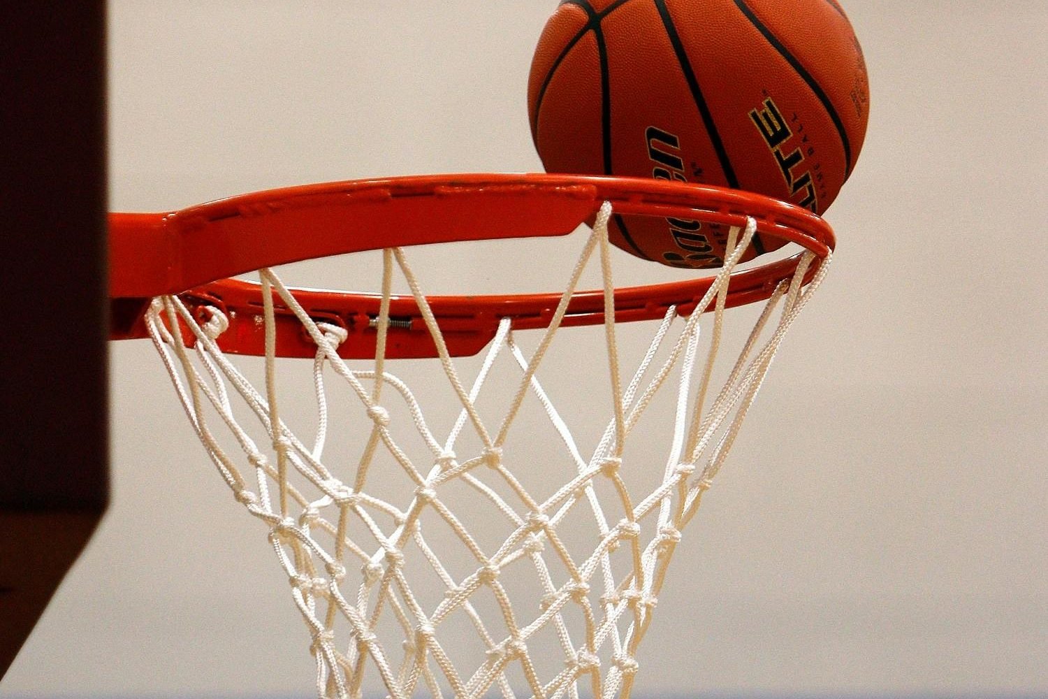pexels-photo-358042-358042 A basketball moment captured as the ball rests on the rim, highlighting the suspense of the game.